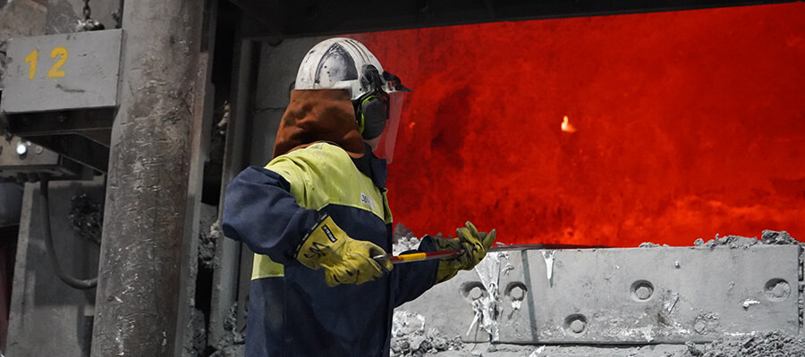 Woman working with molten aluminum